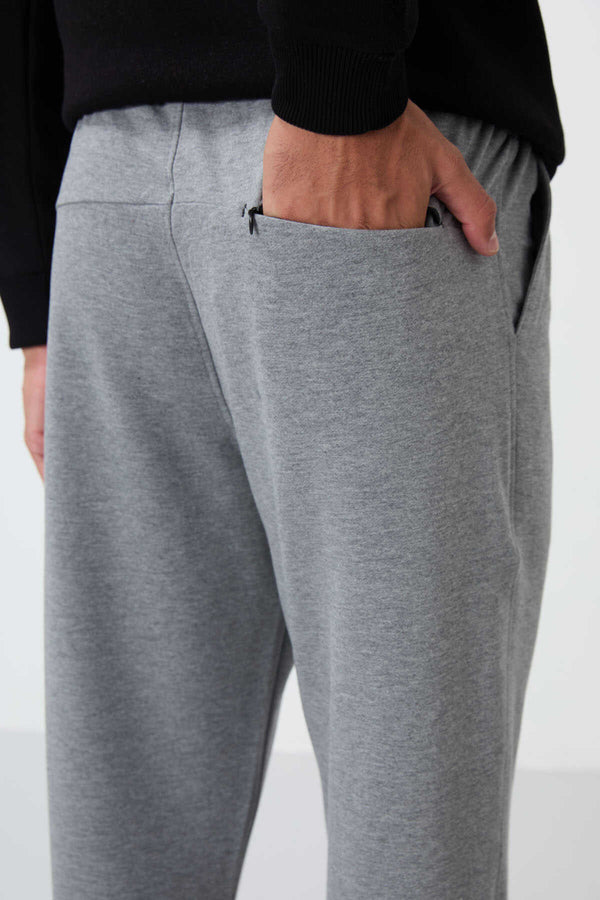 Pantaloni de trening bărbătești gri melanj cu șnur și buzunar, croială standard, model clasic, Tommylife Wholesale - 84682